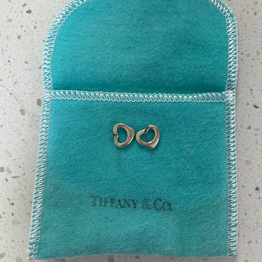 Tiffany & Co. Elsa Peretti open heart earrings in silver.